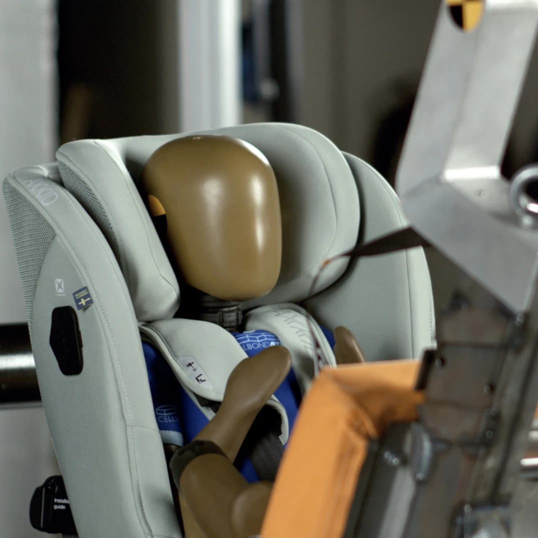Child car seat being evaluated in a controlled crash test environment