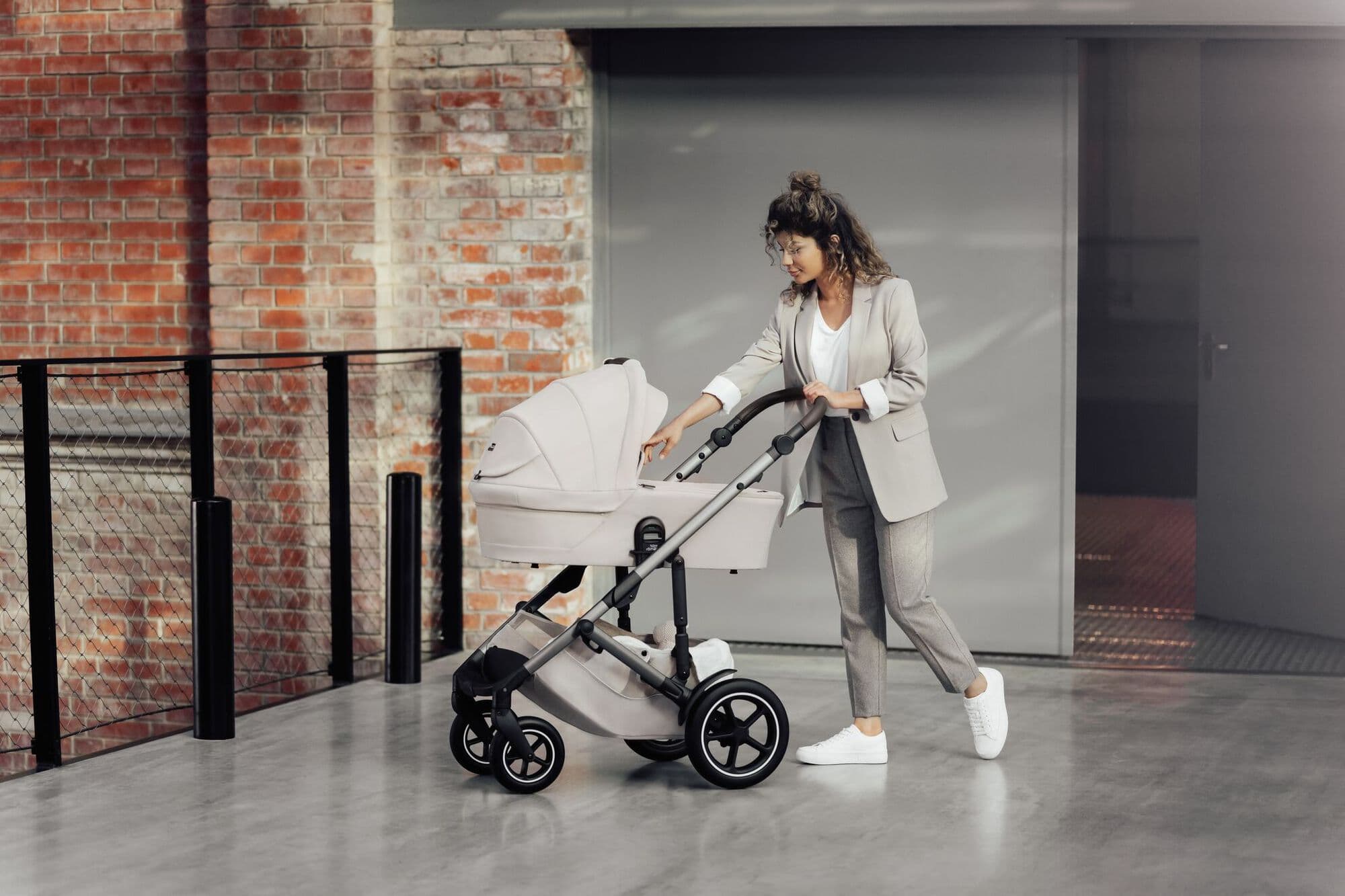 Family walking with a Britax Römer pushchair
