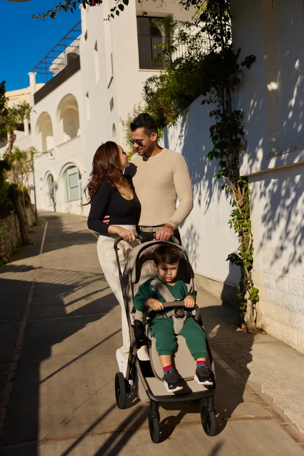 A family out walking with a Venicci Tila pushchair