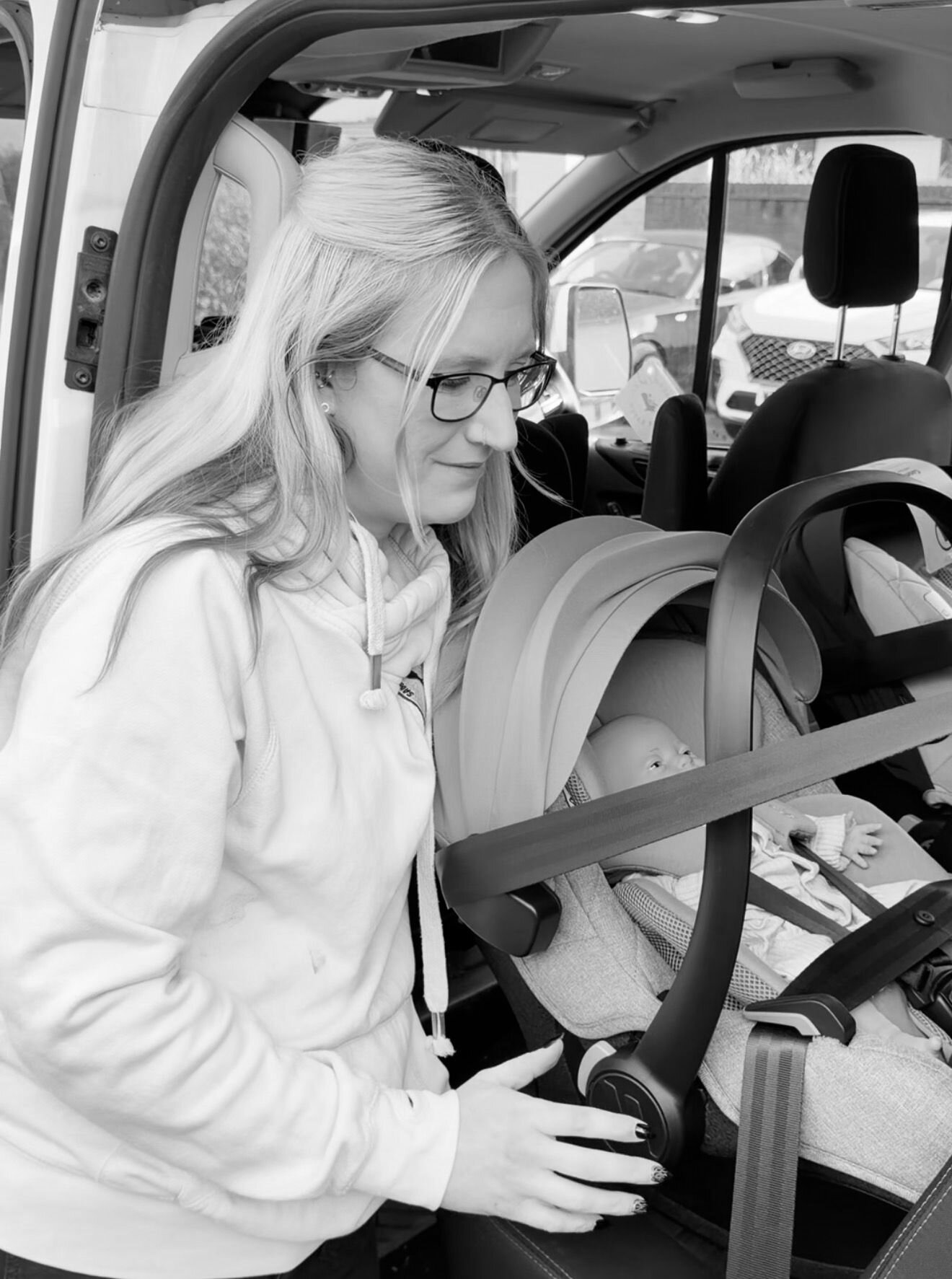 Charlene, car seat fitting specialist at Saunders & Smalls, installing an infant car seat